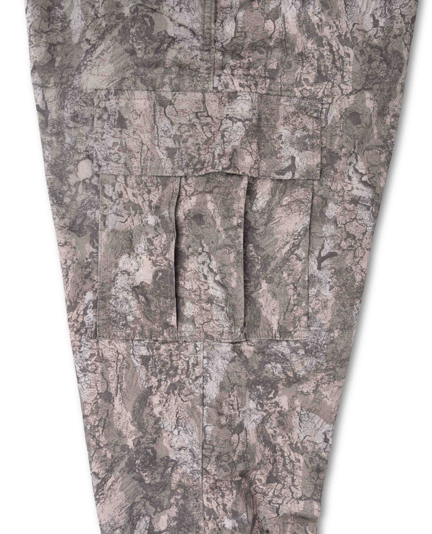 Close-up of camouflage pants showing a mottled gray, brown, and beige pattern with multiple cargo-style flap pockets on the leg.