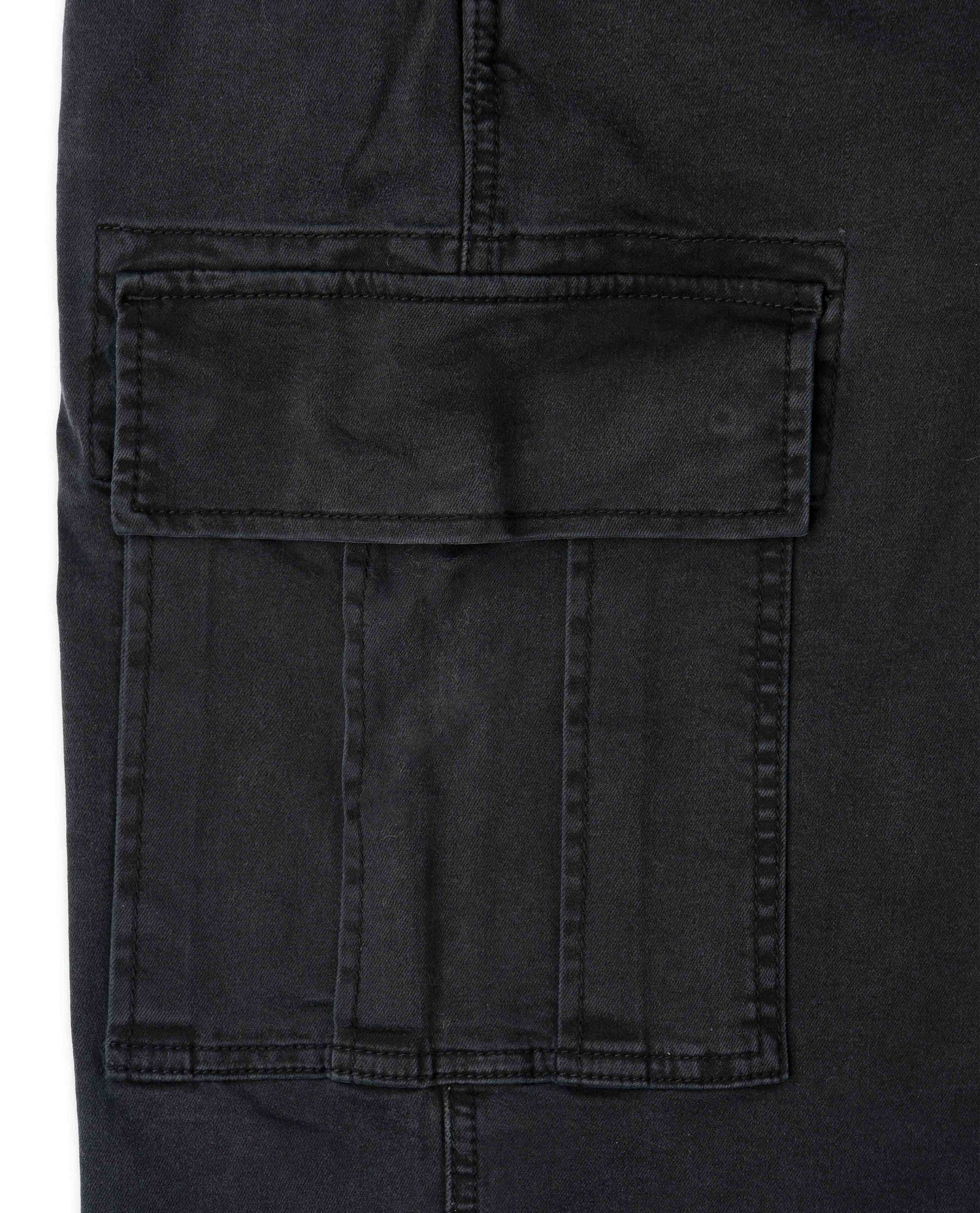 Close-up of a black pocket on a dark fabric background