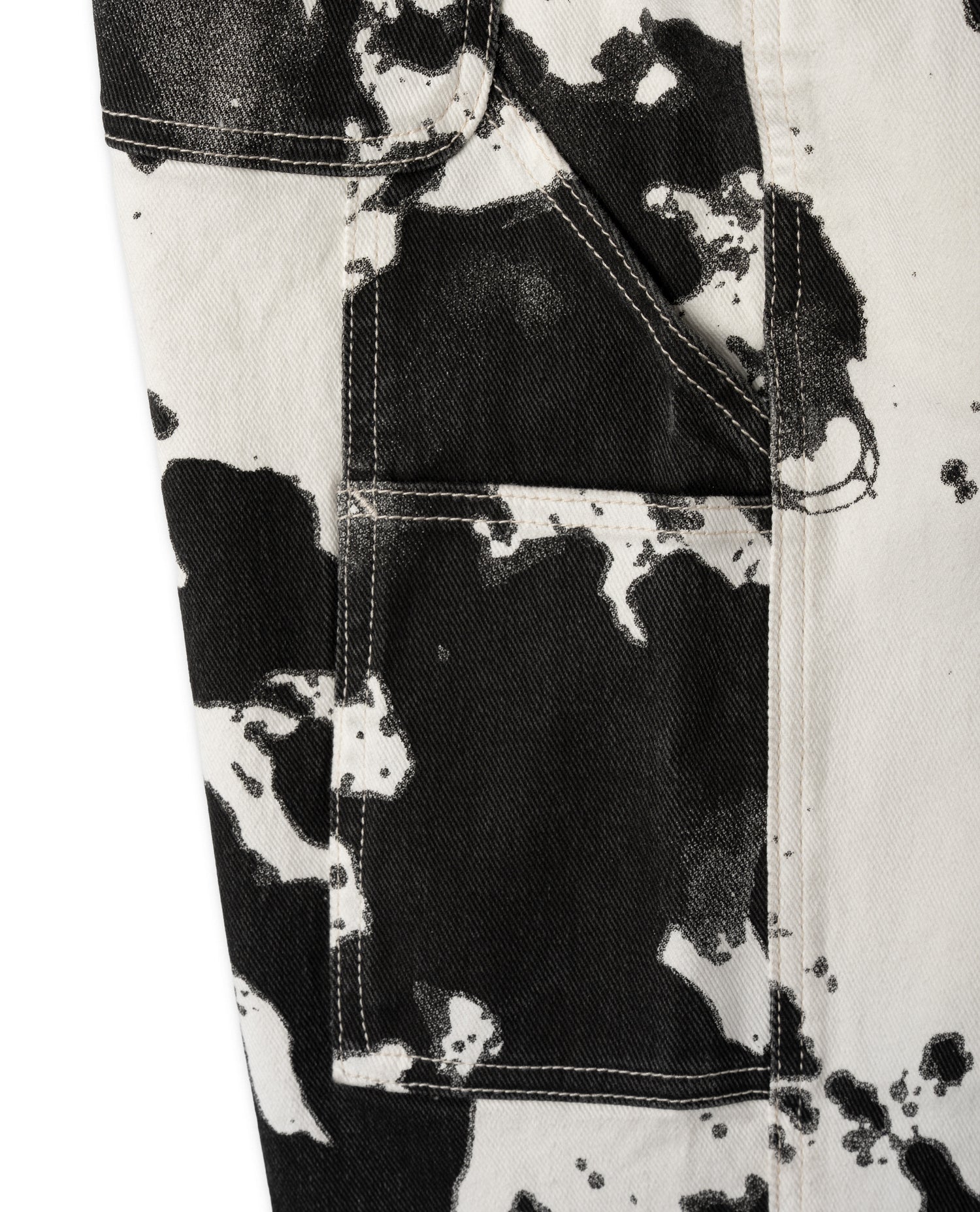 Close-up of a black and white patterned fabric with a pocket detail.