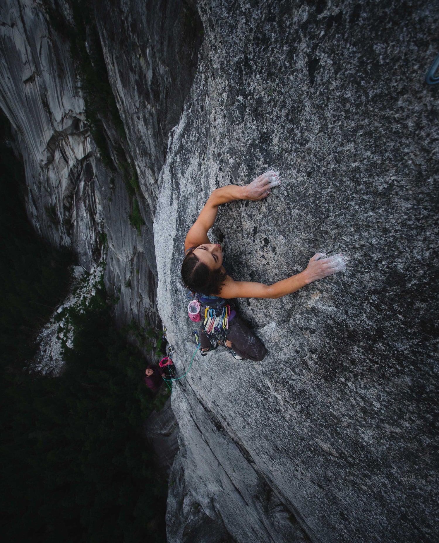 A shot from above of a climber on a rock wall.