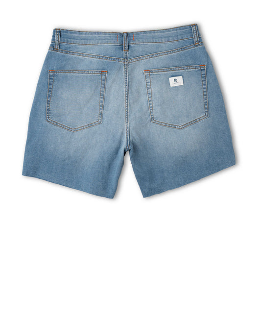 Back view of blue denim shorts on a white background