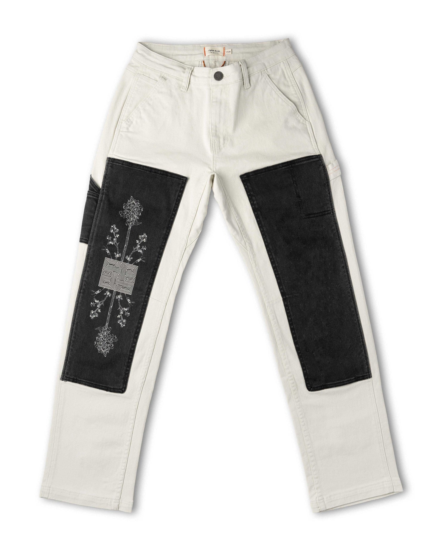 White pants with black patches on a white background