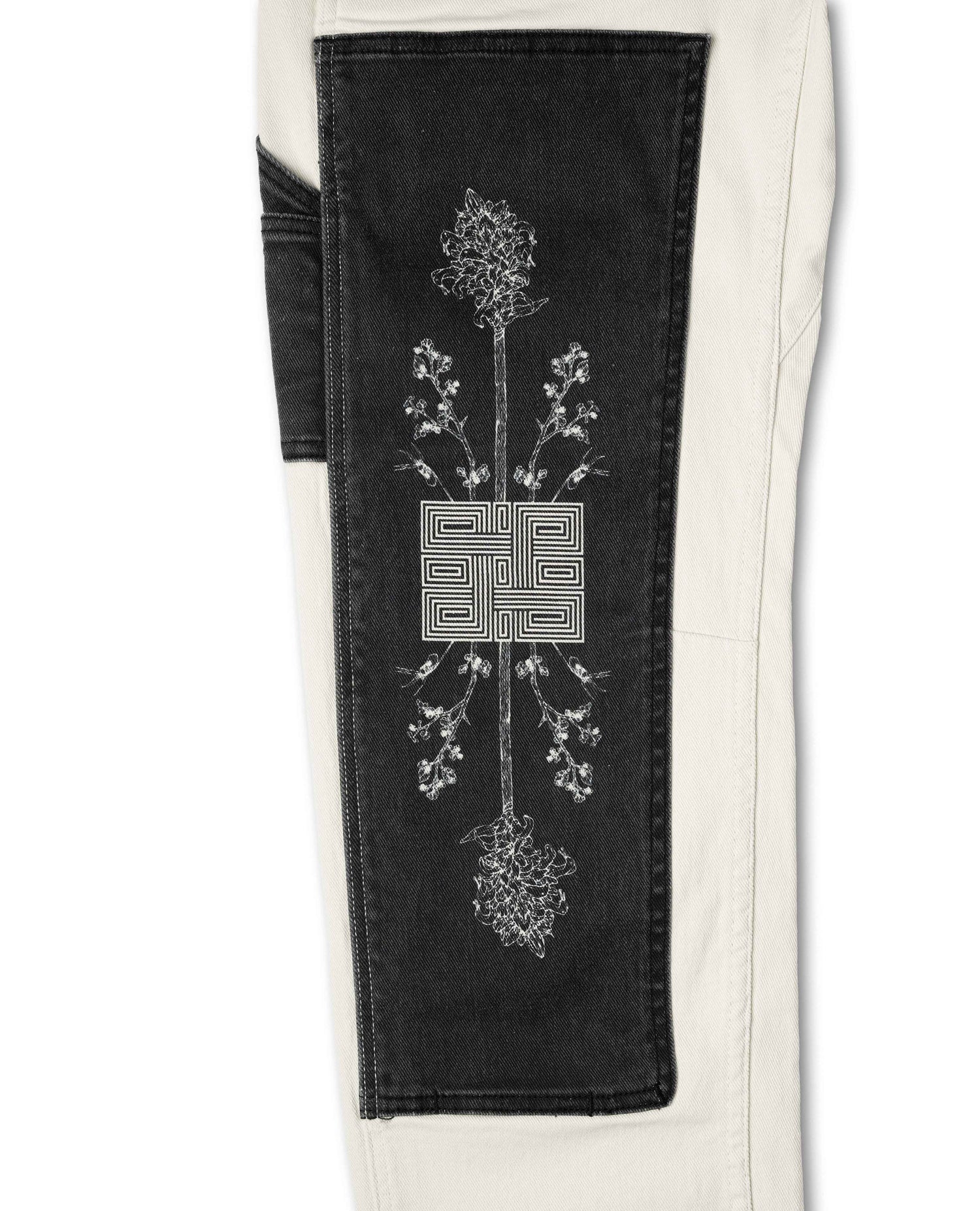 Black patch with floral design and geometric pattern on a white background