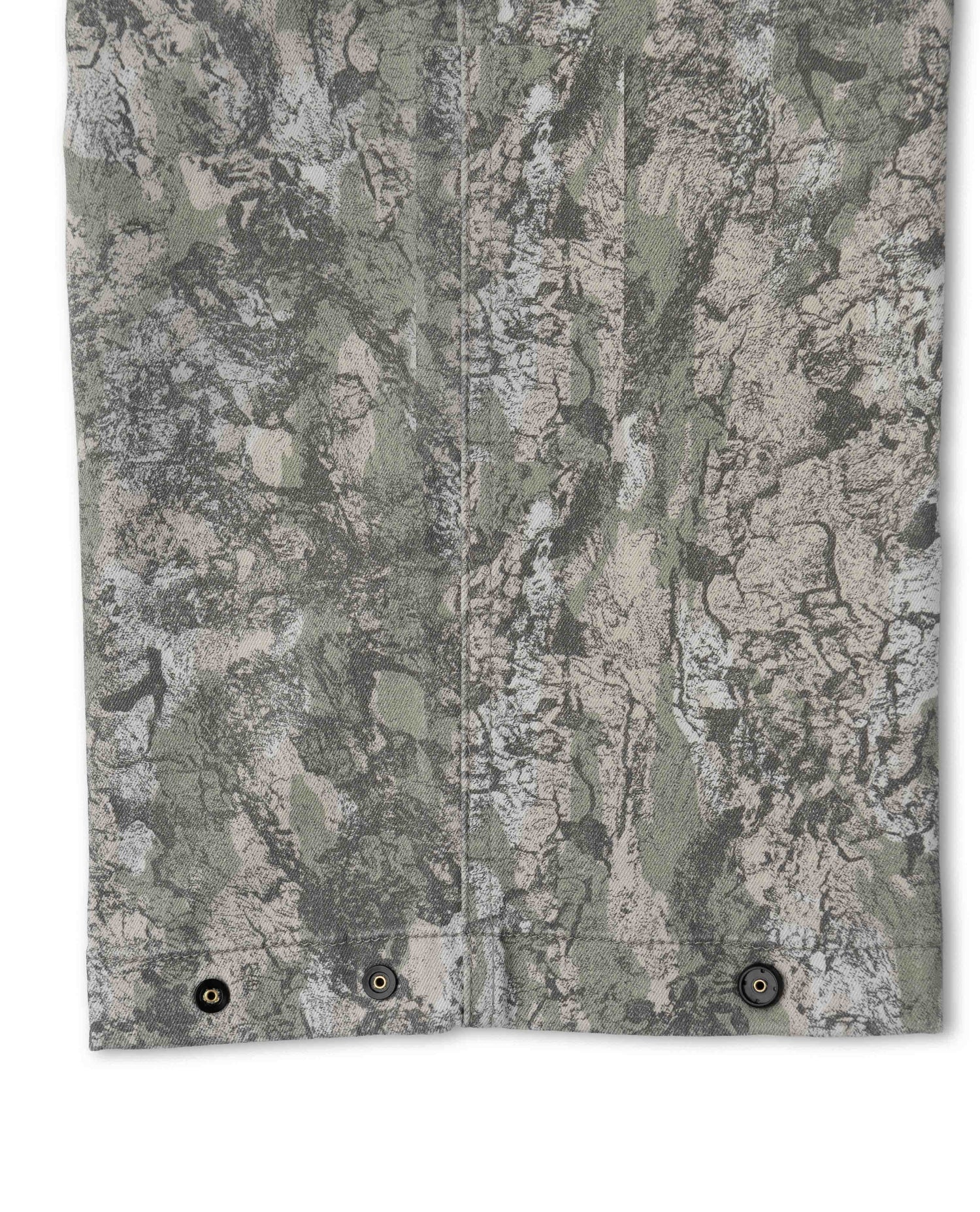 Close-up of a camouflage-patterned fabric with a neutral color scheme.